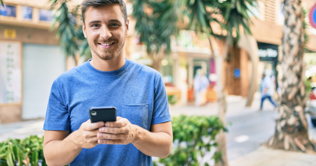 A happy man gets a Spanish mobile SIM card A happy man gets a Spanish mobile SIM card