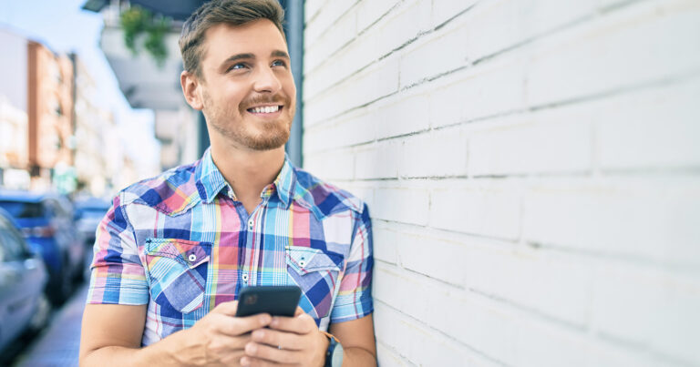 Ordering a SIM card online in Spain Happy man getting a mobile SIM card in Spain