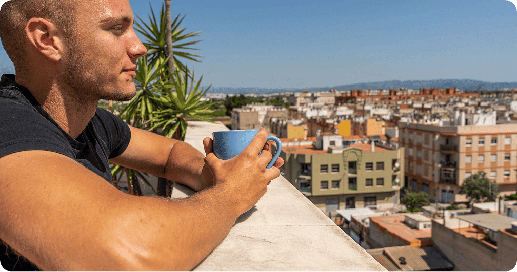 Tom enjoying coffee with Malaga view