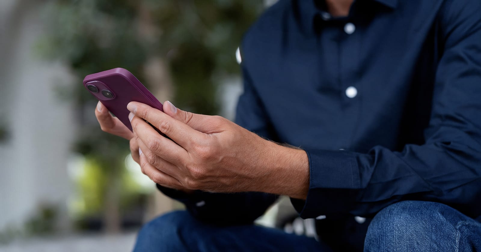 Man using a mobile phone while switching mobile providers in Spain