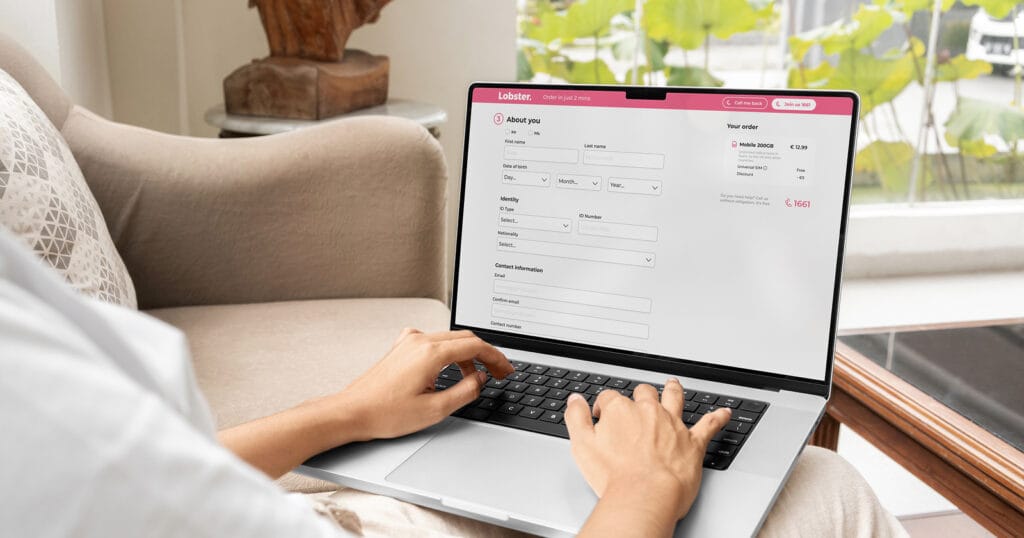 How to Sign Up with Lobster: A Step-by-Step Guide 1 Person entering their personal details in the Lobster SIM order form on a laptop